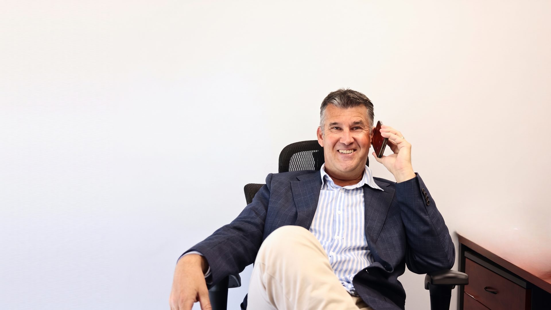 Darren Warner CA taking a client call at DWA Accounting in Albury