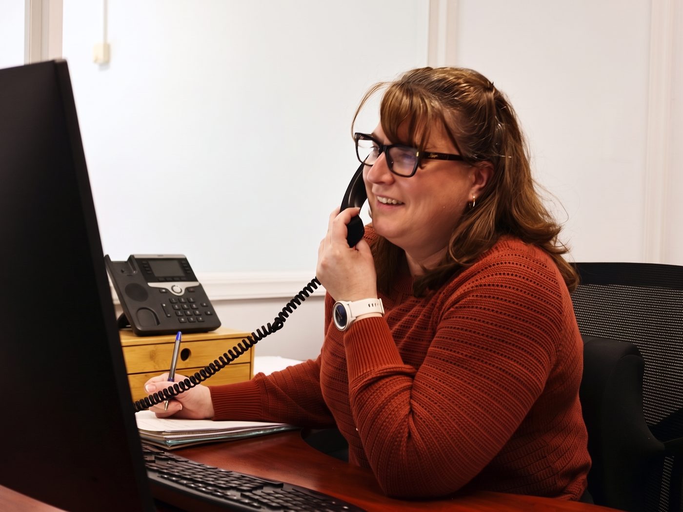 A member of the DWA Accounting team taking a client call at the Albury office